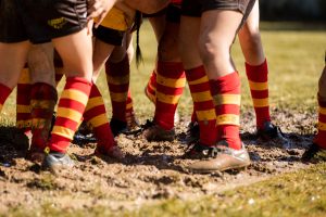 Close up Rhino Rugby game muddy boots